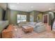 Comfortable living room with stylish sofa, modern decor, and seamless flow to the dining area at 1021 Vickie Ln, Matthews, NC 28104