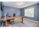Bright home office with a large window, sleek desk, and comfortable chair at 1021 Vickie Ln, Matthews, NC 28104
