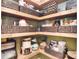 A well-organized pantry with wooden shelves filled with various food items at 1021 Vickie Ln, Matthews, NC 28104