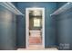 Spacious walk-in closet leading to a luxurious bathroom with a soaking tub at 1021 Vickie Ln, Matthews, NC 28104