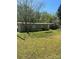 Exterior shot of home with a spacious, tree-filled backyard and patio furniture at 104 Poplar St, Clover, SC 29710