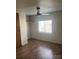 Bedroom with laminate flooring, ceiling fan, and a window with blinds for natural light at 104 Poplar St, Clover, SC 29710
