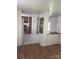 Open-concept living room with wood-look floors, open to kitchen at 104 Poplar St, Clover, SC 29710