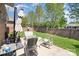Private backyard with a brick fence, patio furniture, and well-maintained landscaping at 106 Independence Ct, Kings Mountain, NC 28086