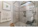 Modern bathroom features a glass shower door, tiled shower, and shower seat at 106 Independence Ct, Kings Mountain, NC 28086