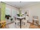 Eat-in dining room featuring a chandelier, large windows, and seating for five at 106 Independence Ct, Kings Mountain, NC 28086