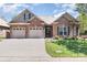 Charming brick home featuring a two-car garage, a well-manicured lawn, and decorative shutters at 106 Independence Ct, Kings Mountain, NC 28086