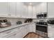 Lovely kitchen features white cabinets, stone countertops and stainless steel appliances at 106 Independence Ct, Kings Mountain, NC 28086