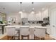 Well-lit kitchen with island, granite counters, stainless appliances, and bar stool seating at 106 Independence Ct, Kings Mountain, NC 28086