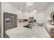 Bright kitchen featuring granite counters, white cabinets, and stainless steel appliances at 106 Independence Ct, Kings Mountain, NC 28086