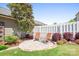 A charming backyard with pea gravel, brick edging, and lush greenery, creating a peaceful retreat at 11447 Potters Row, Cornelius, NC 28031