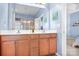 Bathroom with double vanity, tile floor, and a large mirror at 11447 Potters Row, Cornelius, NC 28031