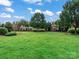 An expansive lawn area highlights homes and landscape at 11447 Potters Row, Cornelius, NC 28031