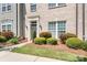 Landscaped front yard features lush greenery, decorative bushes, and a well-maintained lawn at 11447 Potters Row, Cornelius, NC 28031
