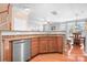 Eat-in kitchen with stainless steel appliances and granite counters overlooks dining area at 11447 Potters Row, Cornelius, NC 28031