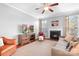 Comfortable living room with fireplace, TV on console, and neutral color palette at 11447 Potters Row, Cornelius, NC 28031