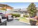 A tranquil outdoor space with patio furniture, garden landscaping, and a white privacy fence at 11447 Potters Row, Cornelius, NC 28031