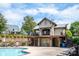 A beautiful community pool featuring a cabana and comfortable lounge seating at 11447 Potters Row, Cornelius, NC 28031