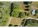 Aerial view of land lot outlined in yellow showing trees and vegetation at 1230 Shearers Rd, Mooresville, NC 28115