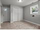 Spacious room with tile flooring, closet, and ample natural light at 1230 Shearers Rd, Mooresville, NC 28115