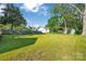 Expansive backyard featuring lush green grass and mature trees, great for outdoor activities at 126 Hemphill Ave, Chester, SC 29706