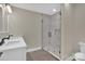 Modern bathroom with double sink vanity, frameless glass shower and tile flooring at 126 Hemphill Ave, Chester, SC 29706