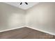 Neutral bedroom with a bright ceiling fan, and wood flooring, promoting calm and comfort at 126 Hemphill Ave, Chester, SC 29706