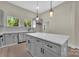 Modern kitchen features an island with a marble countertop and stainless steel appliances at 126 Hemphill Ave, Chester, SC 29706