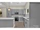 Contemporary kitchen with ample gray cabinetry, white backsplash, and stainless steel appliances at 126 Hemphill Ave, Chester, SC 29706