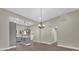 Open-concept living area adjacent to a modern kitchen with sleek gray cabinetry and recessed lighting at 126 Hemphill Ave, Chester, SC 29706