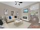 Bright living room featuring a fireplace and seamless flow into a modern kitchen at 126 Hemphill Ave, Chester, SC 29706