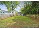 Spacious backyard featuring patio, pergola, shed and green grass at 1327 Fairmont St, Charlotte, NC 28216