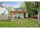 Spacious backyard with a patio, pergola, firepit, and shed at 1327 Fairmont St, Charlotte, NC 28216