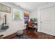 This bedroom features wood floors, natural light, and a dedicated music space at 1327 Fairmont St, Charlotte, NC 28216