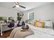 Bright bedroom with a dedicated workspace, natural light, and warm color accents at 1327 Fairmont St, Charlotte, NC 28216