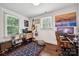 Comfortable bedroom with wood floors, natural light, and a dedicated workspace at 1327 Fairmont St, Charlotte, NC 28216