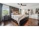 Spacious main bedroom boasts a large window, dark wood floors, and stylish furnishings at 1327 Fairmont St, Charlotte, NC 28216