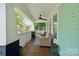 Inviting covered porch with comfortable seating, ceiling fan, and classic railings, perfect for relaxing at 1327 Fairmont St, Charlotte, NC 28216