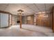 Spacious basement featuring a fireplace, wood paneling, and an open floorplan for flexible living at 1501 Nc Hwy 73 Hwy, Iron Station, NC 28080