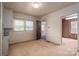 Spacious bedroom features neutral carpet, two windows, and access to an adjoining room at 1501 Nc Hwy 73 Hwy, Iron Station, NC 28080