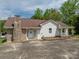 Charming single-Gathering home featuring a stone chimney, covered porch, and white vinyl siding at 1501 Nc Hwy 73 Hwy, Iron Station, NC 28080
