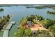 Aerial view showcasing lakeside estate on expansive lot with mature trees and beautiful lake views at 153 High Hills Dr, Mooresville, NC 28117