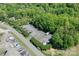 Aerial view of an RV and boat storage lot surrounded by lush trees and power lines at 153 High Hills Dr, Mooresville, NC 28117