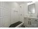 Bathroom with black and white tiled shower, niche, glass, vanity and rectangular mirror at 153 High Hills Dr, Mooresville, NC 28117