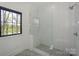 Bright bathroom with a large shower with white subway tile at 153 High Hills Dr, Mooresville, NC 28117