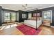 Elegant bedroom with a canopy bed, dark walls, and hardwood floors at 153 High Hills Dr, Mooresville, NC 28117