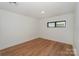Cozy bedroom with wood floors, recessed lighting, and a window with a neighborhood view at 153 High Hills Dr, Mooresville, NC 28117