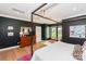 Stylish bedroom with a canopy bed, dark accent walls, and natural light at 153 High Hills Dr, Mooresville, NC 28117