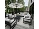 Relaxing deck area featuring modern outdoor furniture and stylish decor for luxurious outdoor living at 153 High Hills Dr, Mooresville, NC 28117