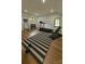 Well-equipped home gym with various exercise machines and weights at 153 High Hills Dr, Mooresville, NC 28117